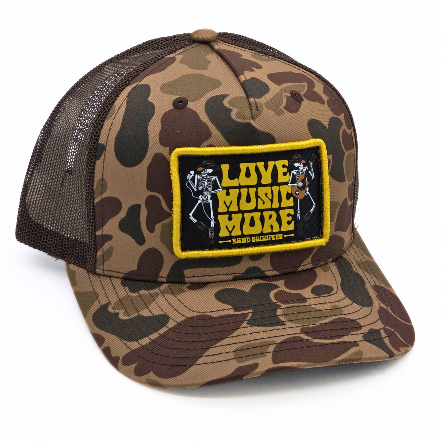 Camouflage cap with a patch that says 'Love Music More' on a white background