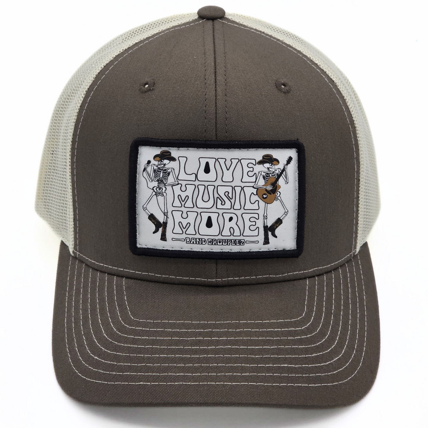 Gray and white trucker hat with a patch featuring skeletons playing music on a white background