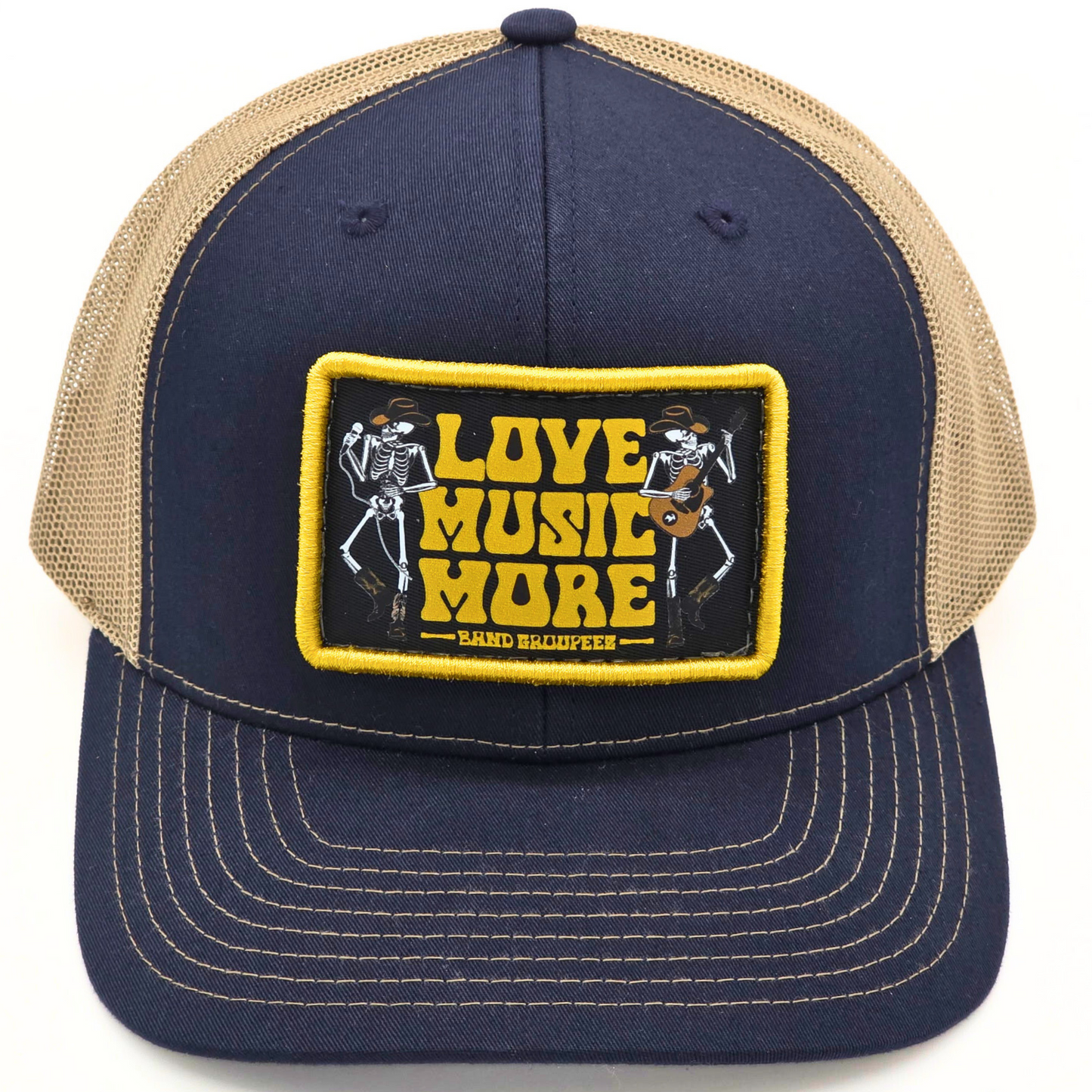 Navy blue and beige cap with 'Love Music More' patch on a white background