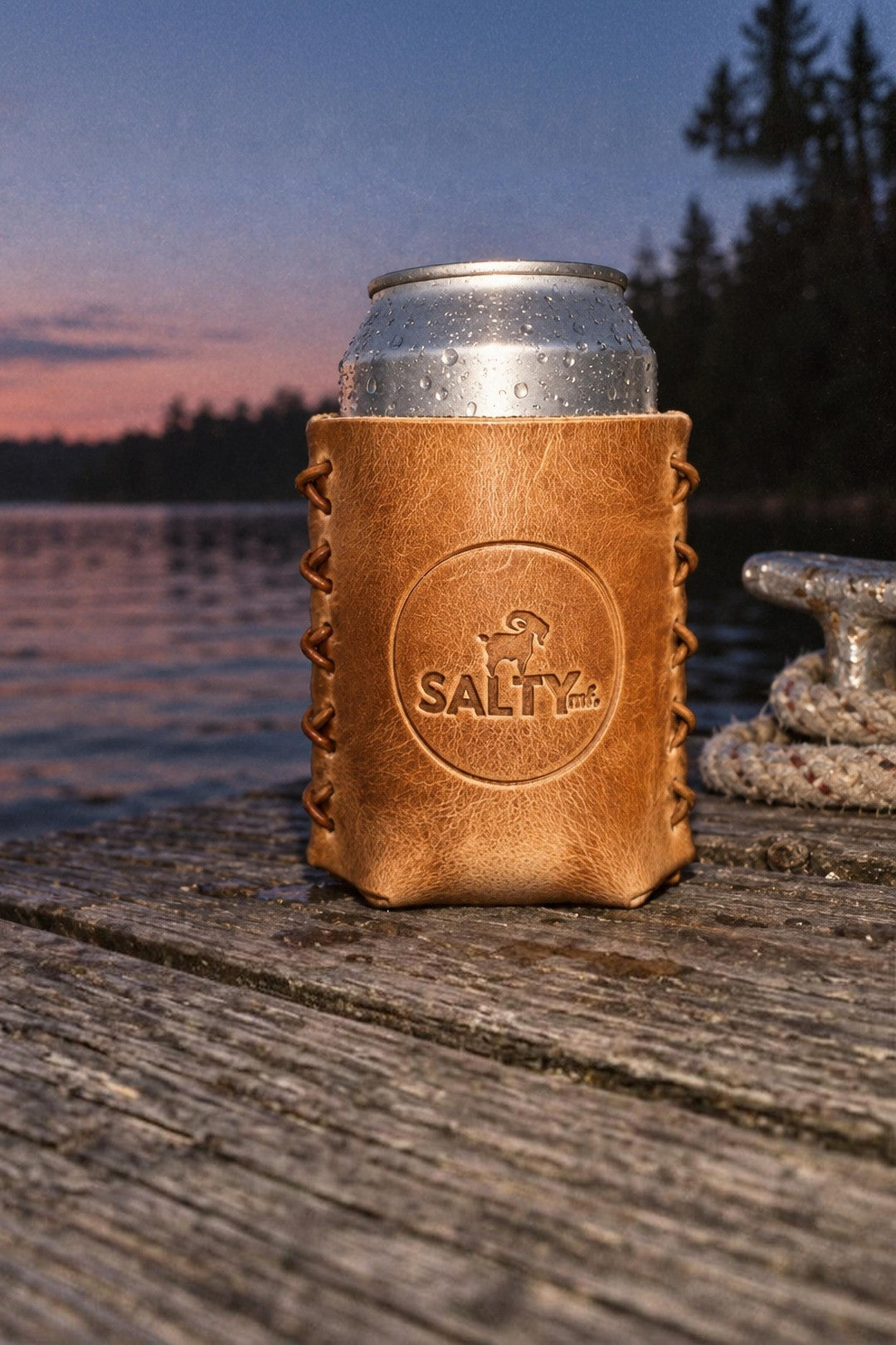 SALTYmf leather coozie on a lake dock at dusk
