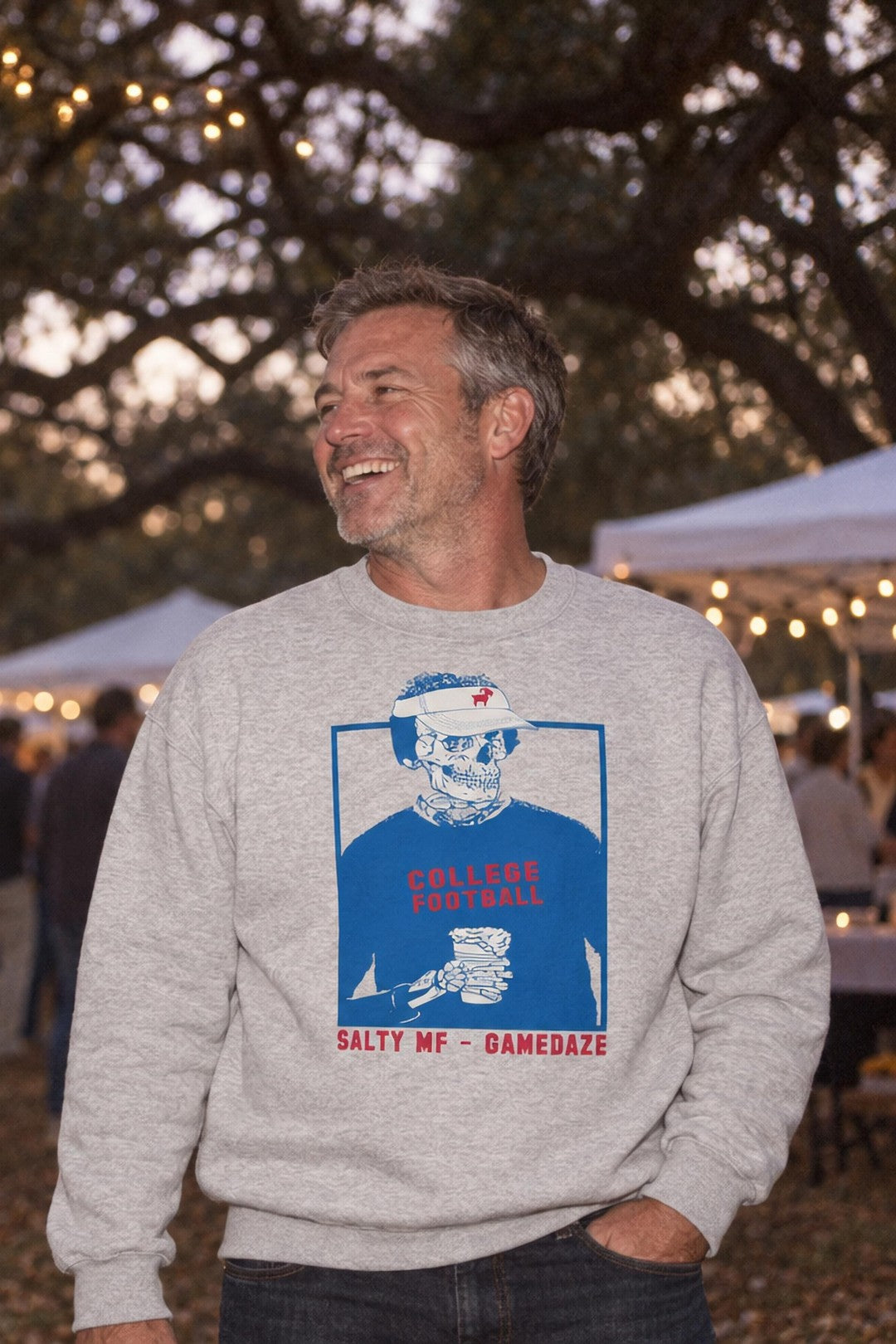 Man in the SALTYmf Oxford GameDaze crew neck at a tailgate under the oaks